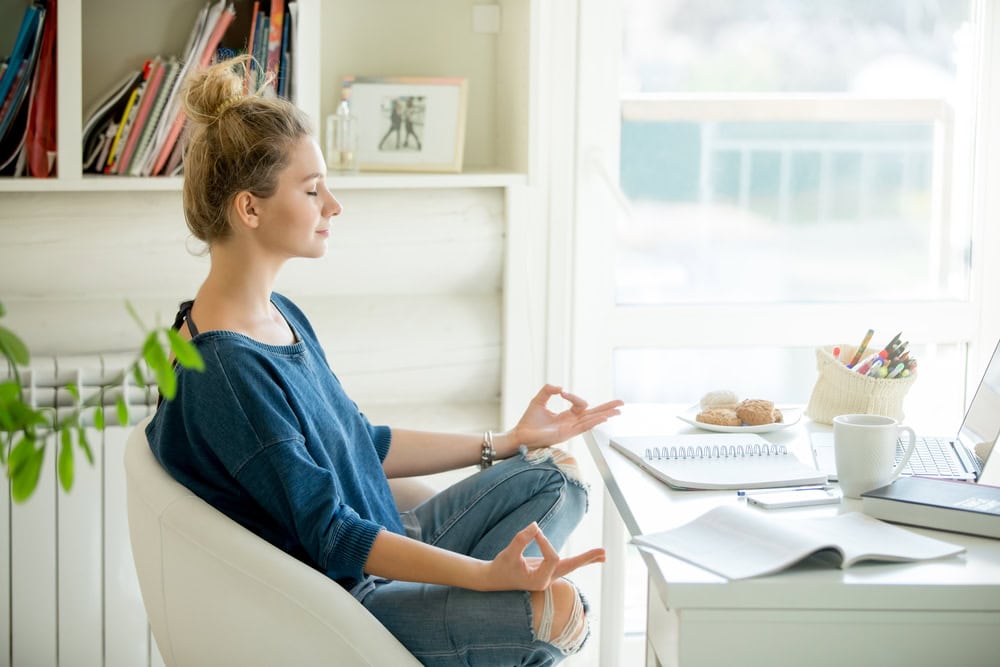 photo of a woman meditating. What is holistic addiction therapy? Mindfulness meditation and other practices often make up holistic addiction therapy.