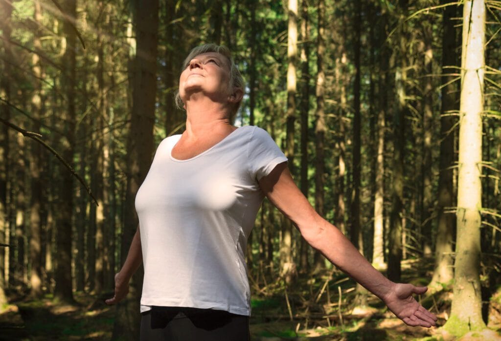 women breathing in fresh air 